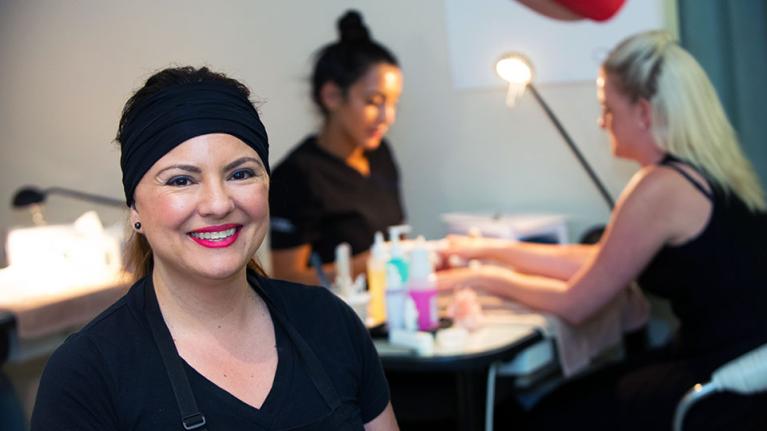 Beauty students and clients in the salon.
