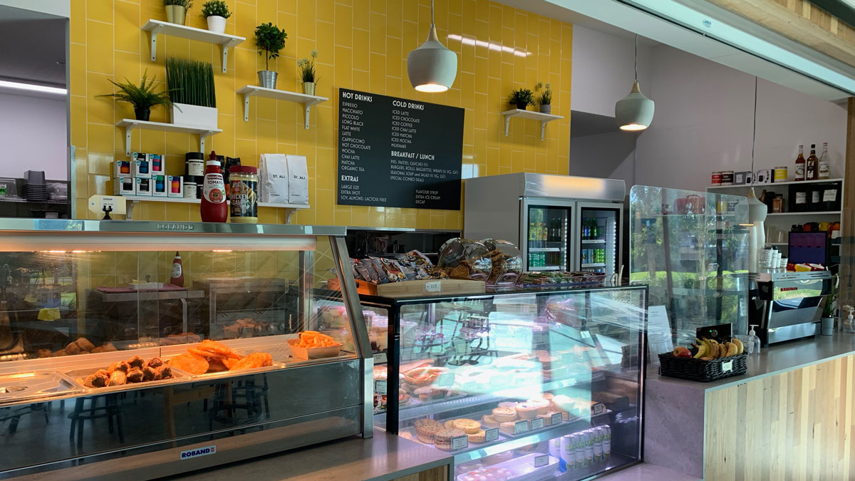 A cafe with hot and cold food on display.