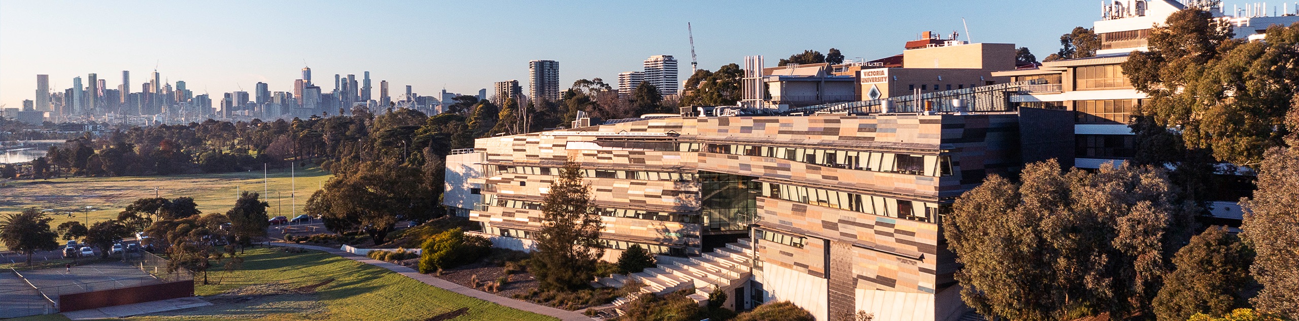 Aerial photo of P Block at Footscray Park Campus. Melbourne CBD can be seen on the horizon.