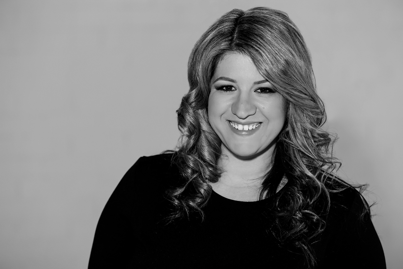 Black and white photo of Mish Fornito looking at the camera and smiling