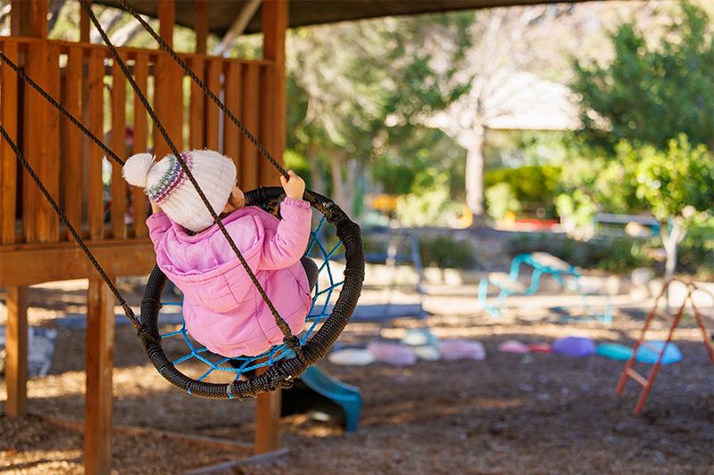 child in swing