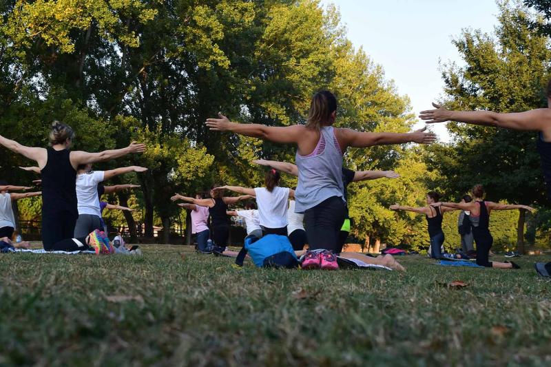 A yoga class in park