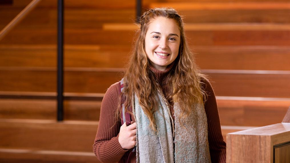Student Maneesha Patterson standing by the main stairwell inside VU City Tower campus.