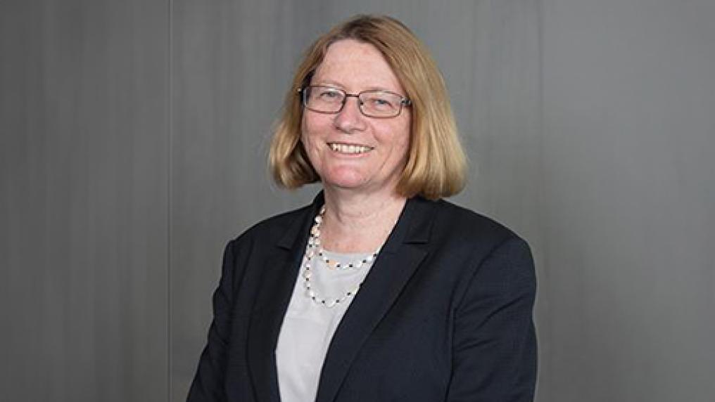 A smiling woman in professional clothes