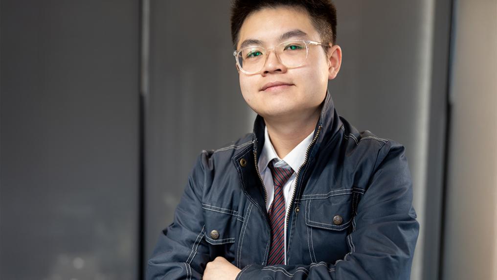 A young man poses for the camera
