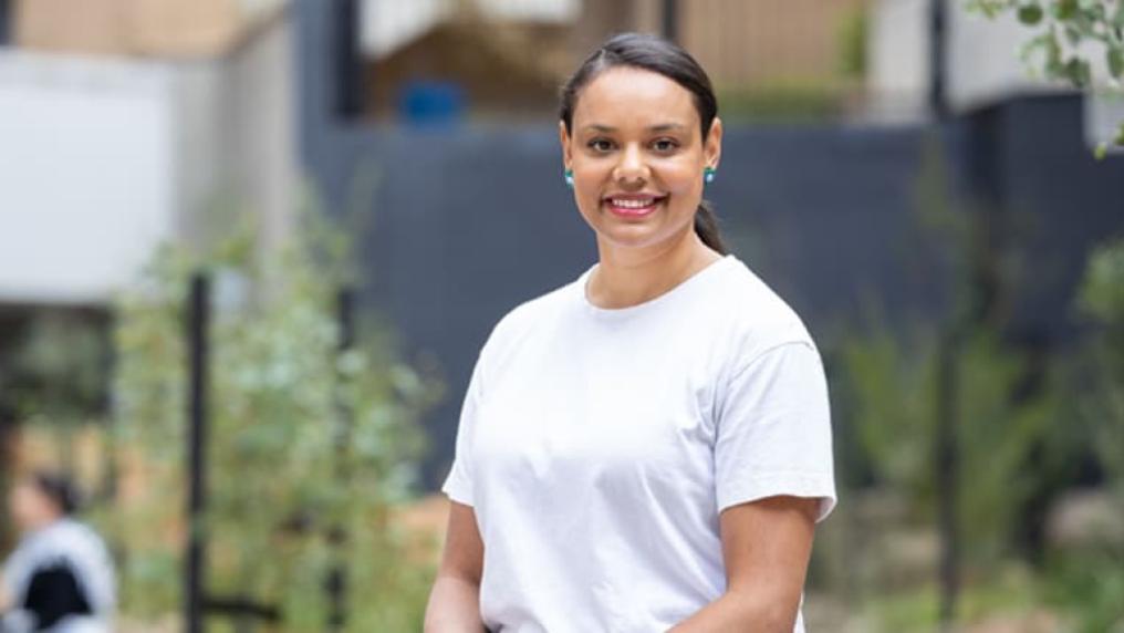VU student standing outdoors and smiling on Footscray Park campus