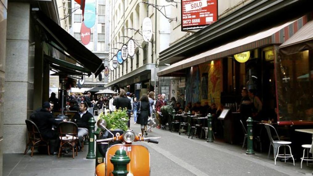 An orange scooter parked in Melbourne's Degraves Street.