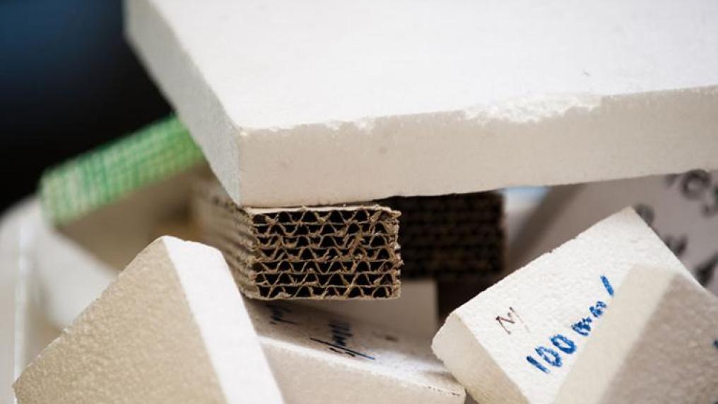 Close up shot of styrofoam and cardboard packaging waste.